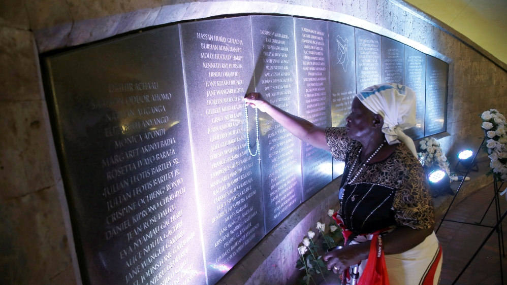Family members of victims attend a ceremony at the August 7th memorial park in Nairobi, Kenya [Baz Ratner/Reuters]