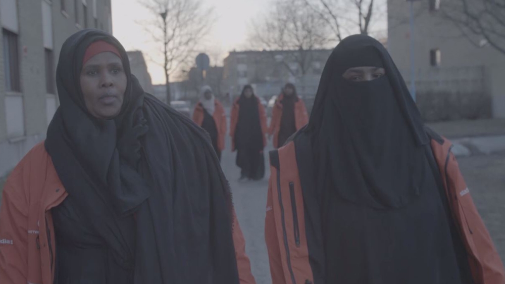 The mothers on their nightly patrols of Rinkeby, Sweden. [Al Jazeera]