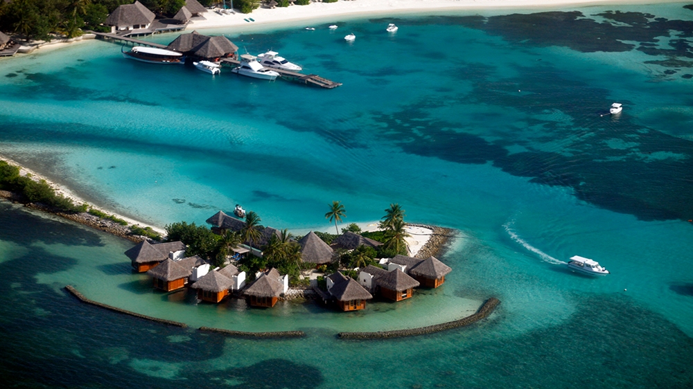 An aerial view shows a resort island at the Male Atoll December 7, 2009. Maldives has a population of some 400,000 islanders, whose livelihood from fishing and tourism is being hit by climate change.