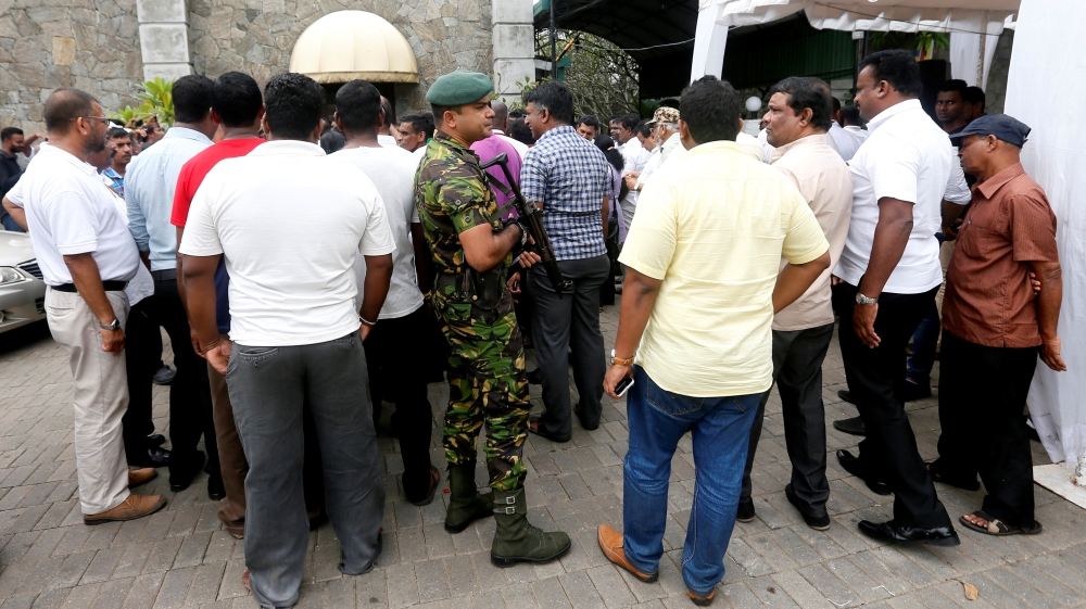 Supporters of the sacked PM gathered outside his official residence in Colombo [Dinuka Liyanawatte/Reuters] 