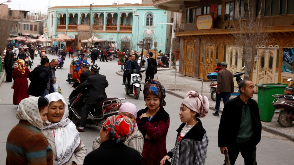 FILE PHOTO: People mingle in the old town of Kashgar