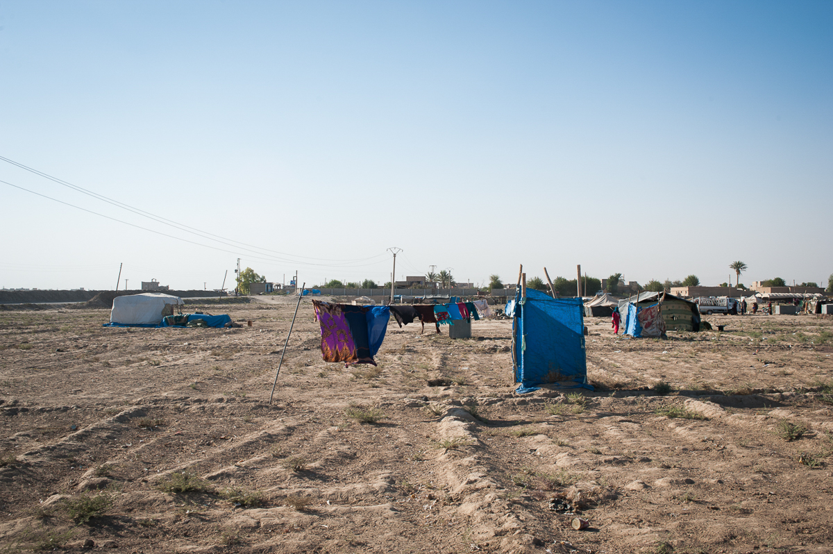 200 families live in the camp of Bahara. The hygienic conditions are very poor. In the picture the blue curtain is the communal toilet. September 2018