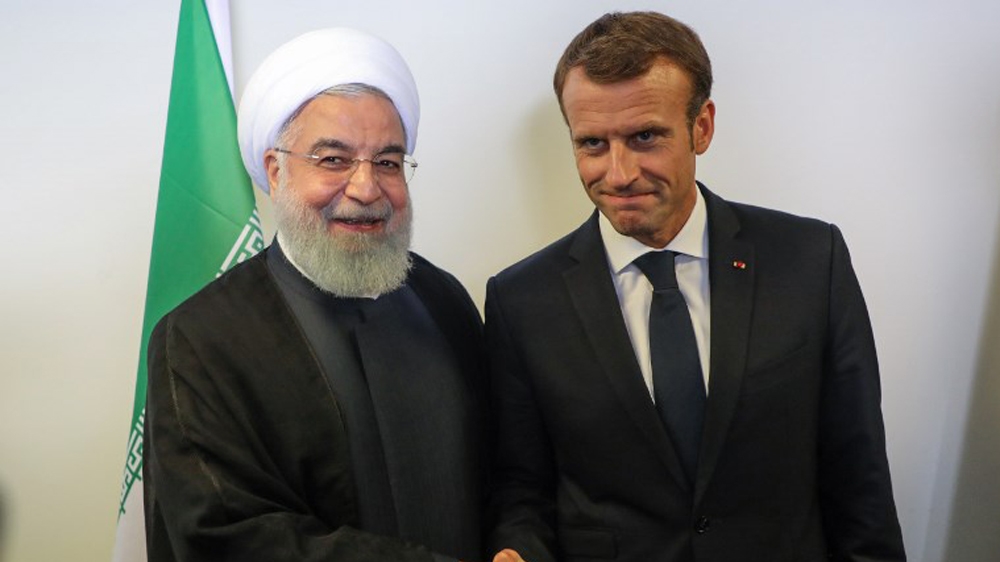 President Emmanuel Macron (R) meets with Iranian President Hassan Rouhani