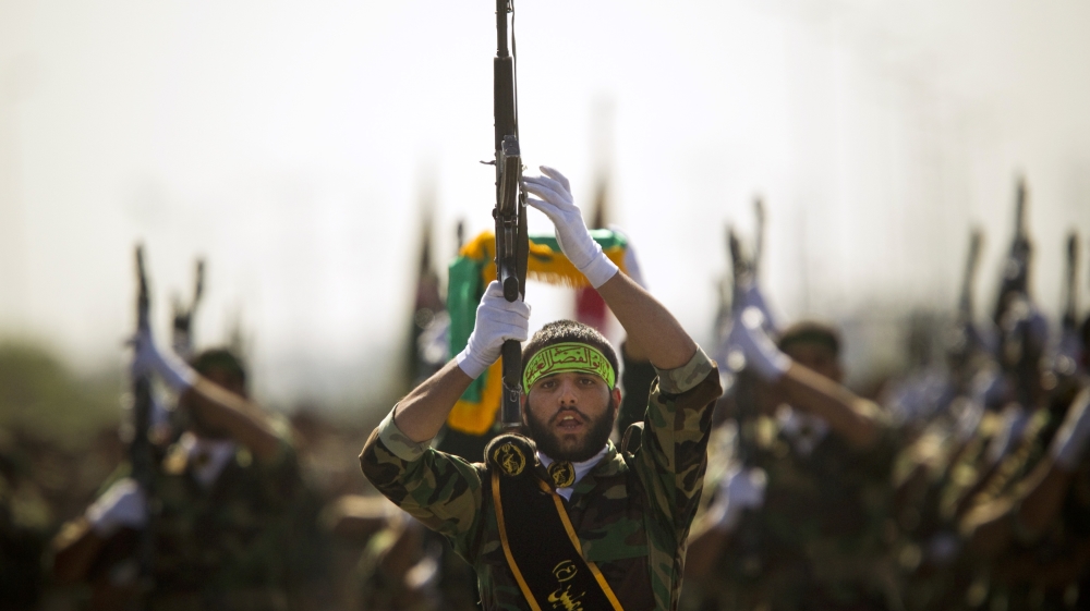 Members of Iran''s Basij militia march during a parade to commemorate the anniversary of the Iran-Iraq war (1980-88), in Tehran