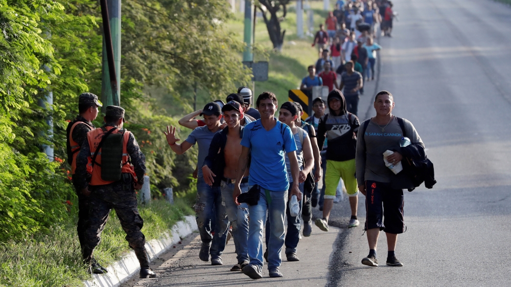Central American migrants, part of a second wave of migrants heading to the U.S., walk along a highway as they continue their journey to the Mexican border, in Zacapa, Guatemala October 24, 2018.