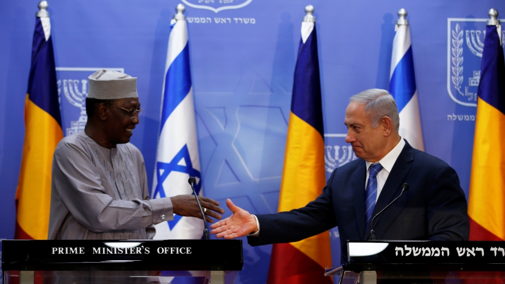 Israeli Prime Minister Benjamin Netanyahu prepares to shake hands with Chadian President Idriss Deby as they deliver joint statements in Jerusalem