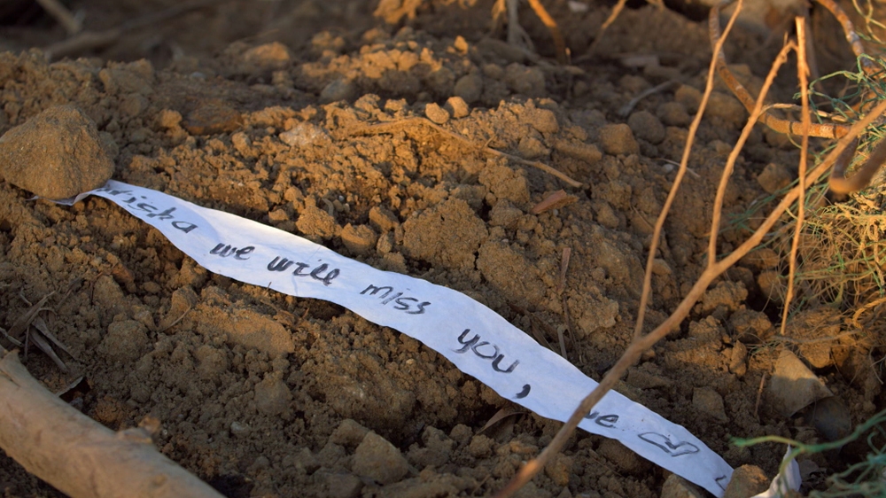 A makeshift grave marks one of the thousands of lives lost during Typhoon Haiyan. [Al Jazeera]