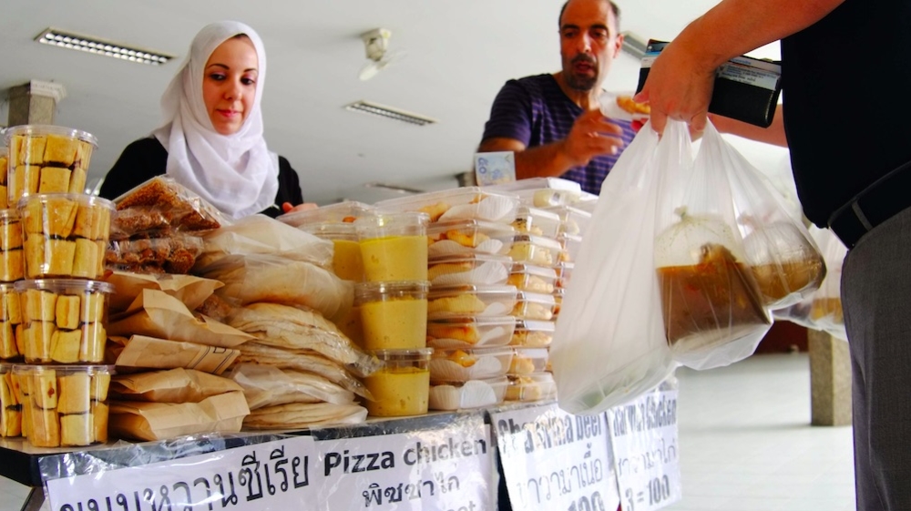 Syrian-Palestinian refugees sell traditional food every Friday at the Islamic Center in Bangko [Panithan Kitsakul]