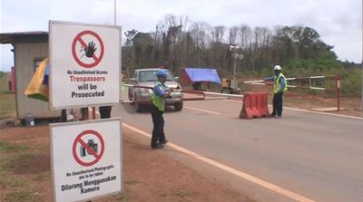 A security barrier near the entrance of the controversial Australian-owned Lynas plant [Al Jazeera]