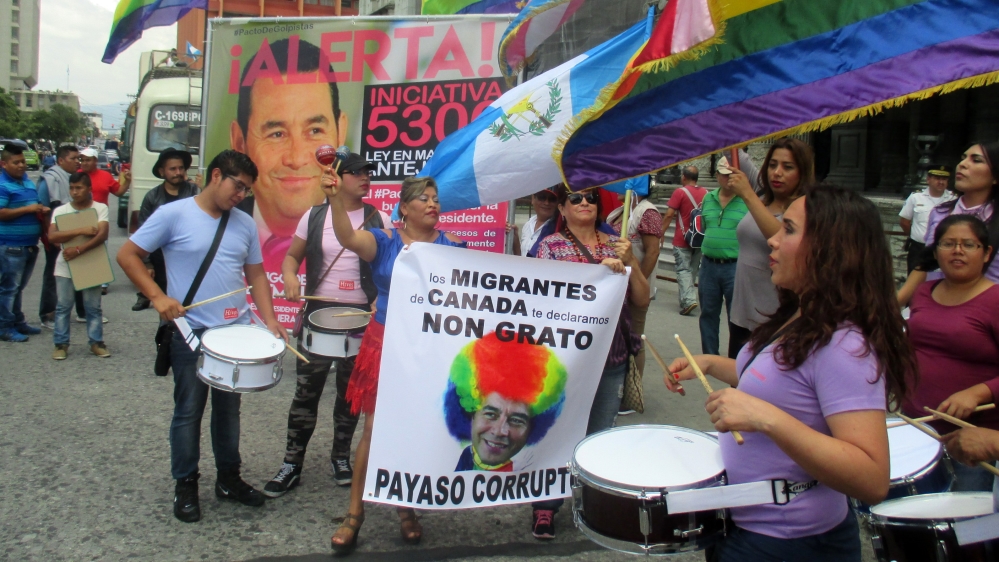 Reinas de la Noche Trans Association spokeswoman Adriana Munoz drums at a Guatemala City protest against President Jimmy Morales [Sandra Cuffe/Al Jazeera]