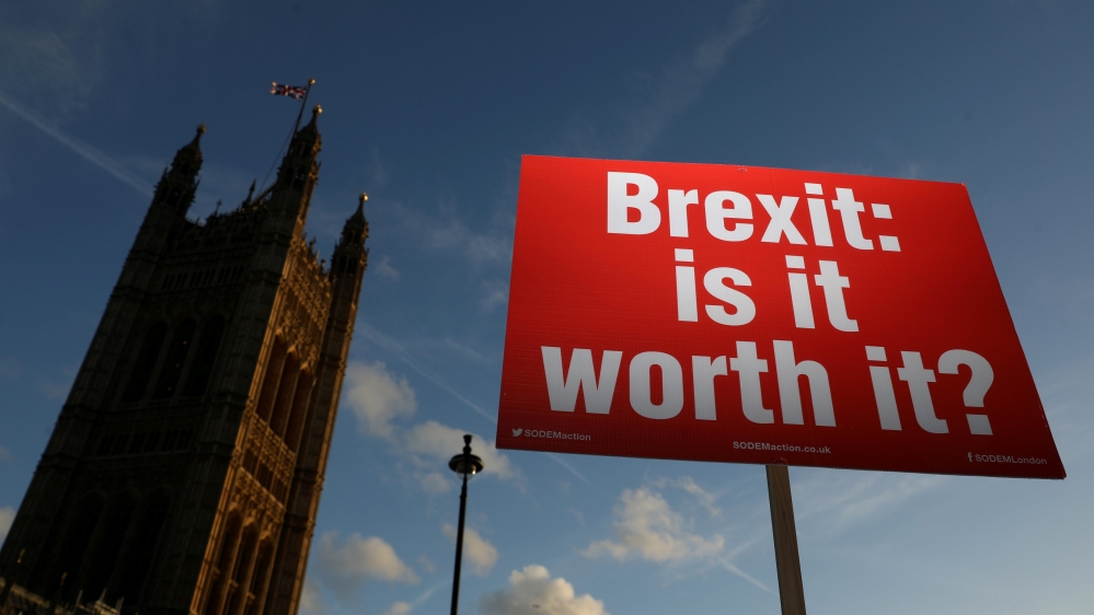 An anti-Brexit demonstrator holds a placard opposite the Houses of Parliament, in London, Britain, November 13, 2018