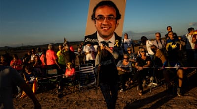 Pro-independence Catalans have taken up the cause of the imprisoned politicians, holding posters with their images at protests [David Ramos/Getty Images]