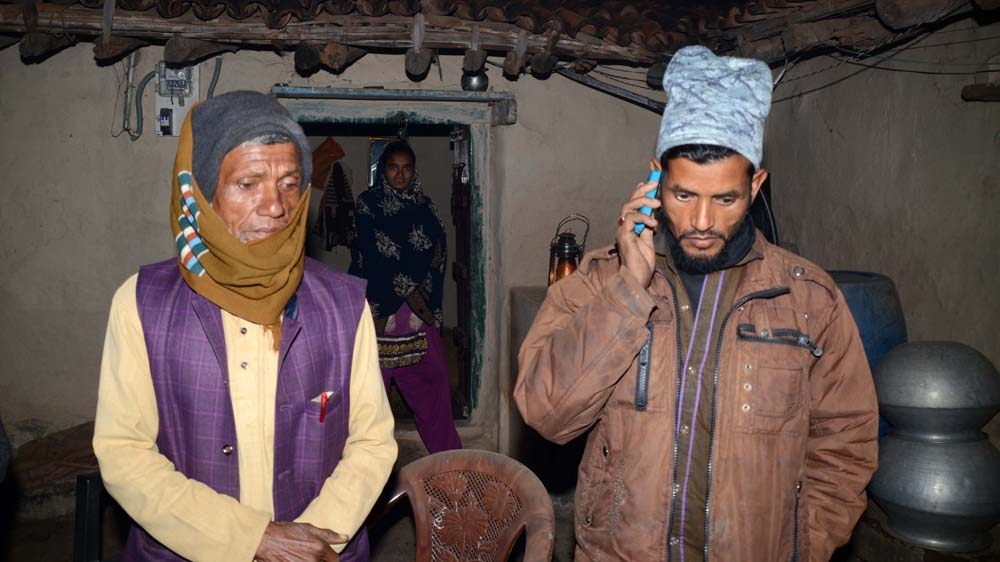 Mohammad Ibrahim and Mohammad Imtiaz (R), Majloom Ansari's father and brother, in their house in Nawada village [Manob Chowdhury/Al Jazeera]