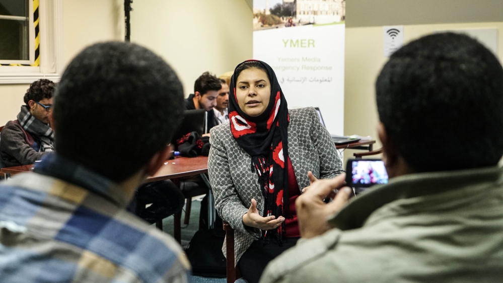 Members of the Yemen Peace Newsroom interview a delegate at the peace talks [Faisal Edroos/Al Jazeera]
