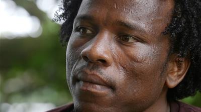 Aziz Abdul Muhamat, a 25-year-old refugee from Sudan, has been held on remote Manus Island for more than five-and-a-half years, after trying to get to Australia by boat [Bill Code/Al Jazeera]