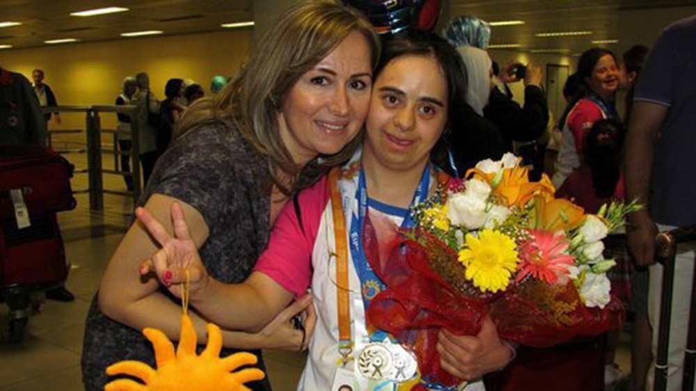 Nina's mother Souad and Nina coming home after the 2011 International Special Olympics in Athens [Al Jazeera]