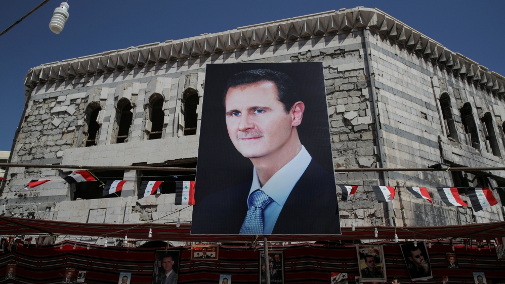A banner depicting Bashar al-Assad