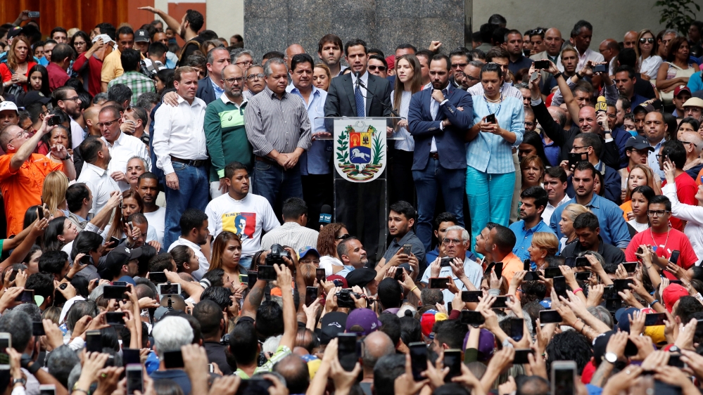 Venezuela's opposition leader Guaido speaks during a news conference in Caracas [Carlos Garcia Rawlins/Reuters]