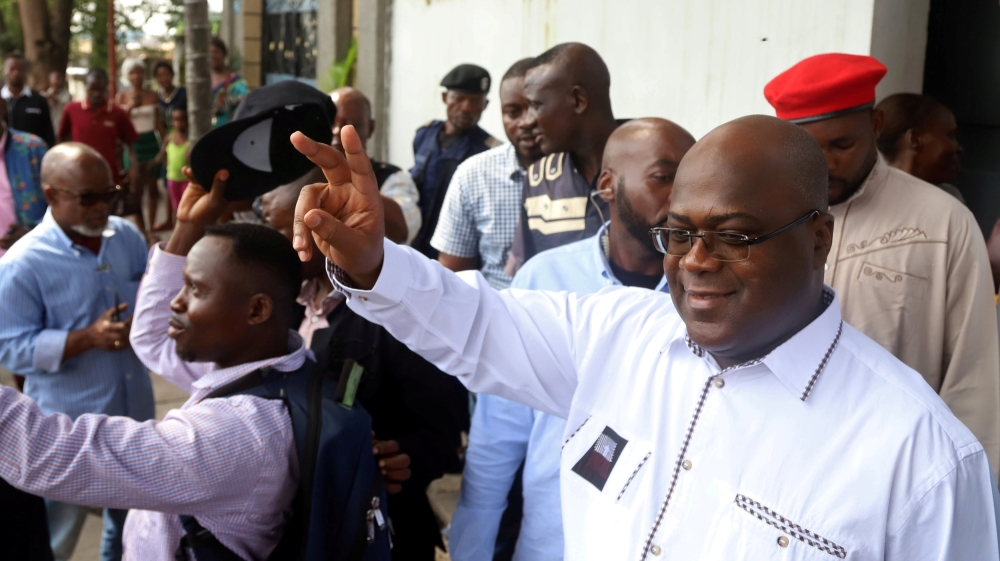 FILE PHOTO: Felix Tshisekedi, leader of the Congolese main opposition party, the Union for Democracy and Social Progress (UDPS), and a presidential candidate, leaves after casting his ballot at a poll