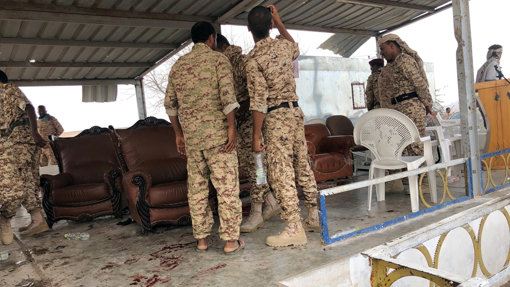 Soldiers inspected the scene of the Houthi drone attack on the al-Anad air base [Reuters]