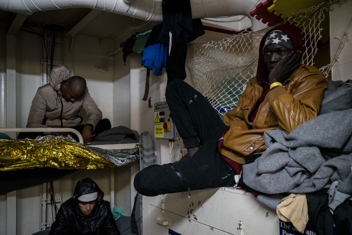 Migrants are seen in the shelter room where they live at night, volunteers form the ship organized some tv screening for them. Life onboard the Dutch-flagged rescue vessel Sea Watch 3 is hard and frus