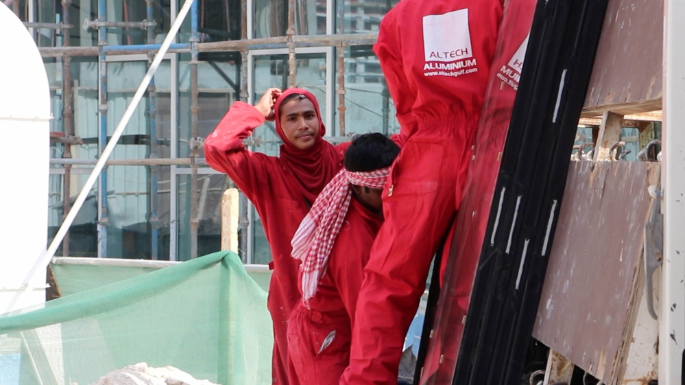 Thousands of construction workers toil six days a week [Ayilah Chaudhary /Al Jazeera]