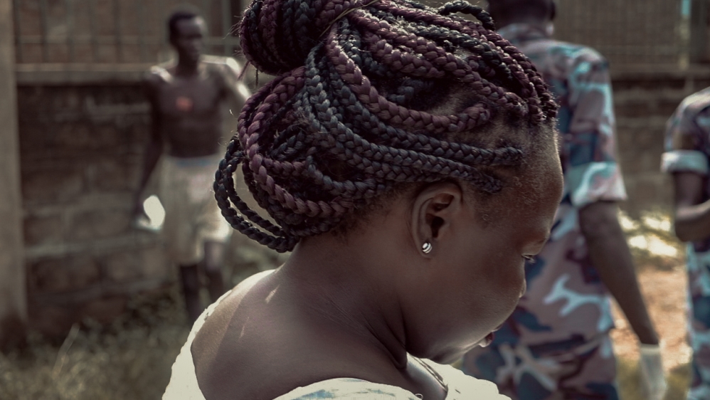 Dr Atong Ayuel makes sure a homeless man who refuses to partake in her project is left alone, since participation is voluntary [Jasmin Bauomy/Al Jazeera]