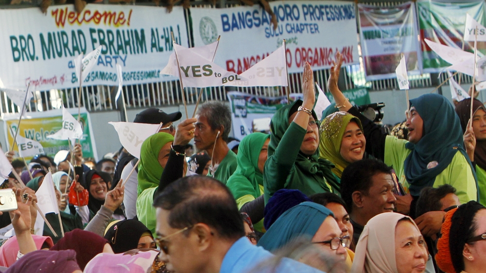 The new law seeks to decommission 35,000 rebels in a new civilian government. [Ben Hajan/EPA]