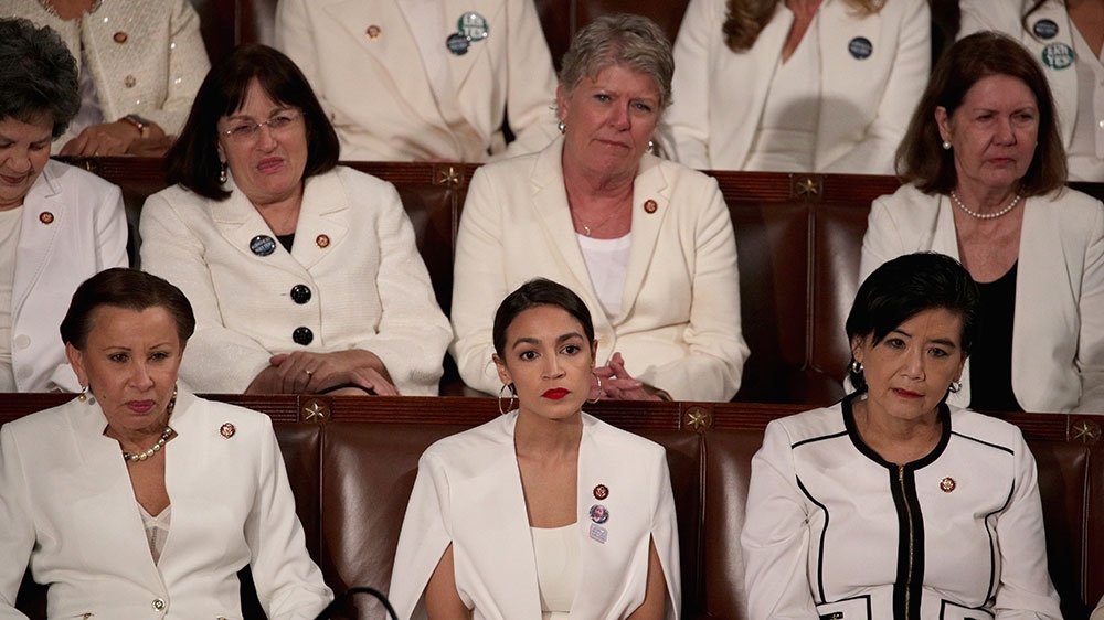 Many House Democratic women wore white, a colour favoured by early 20th-century suffragettes [Alex Wong/Getty Images/AFP] 