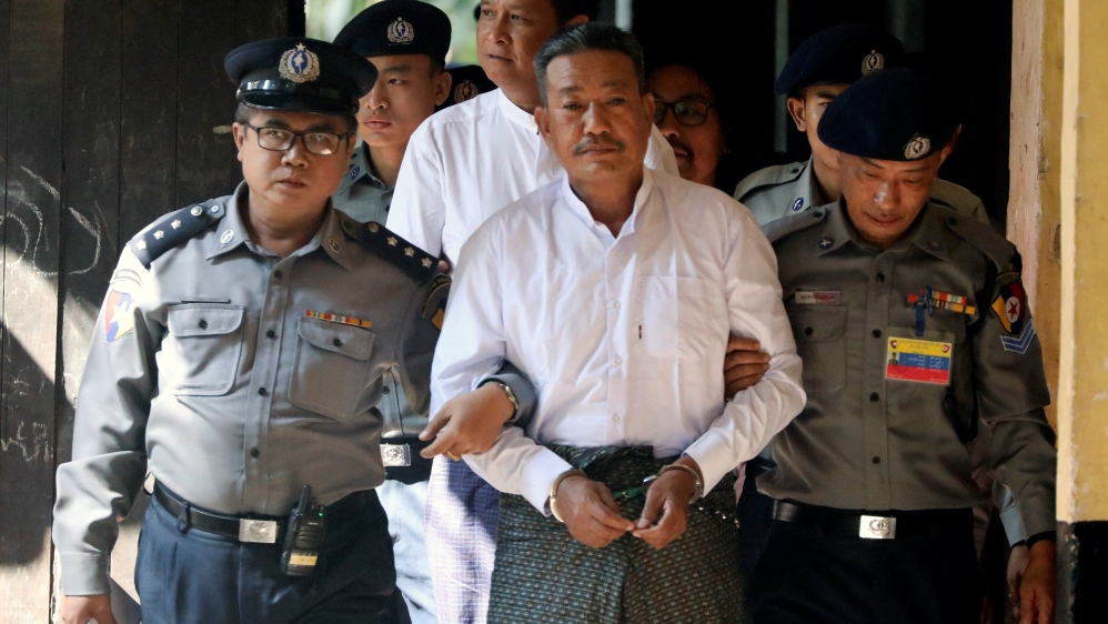 Kyi Lin and Aung Win Zaw, who are accused of Ko Ni's murder, arrive at Insein court in Yangon [Ann Wang/Reuters]