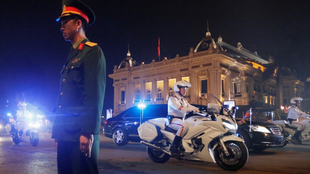 Kim's motorcade leaves following his meeting with Trump [Ann Wang/ Reuters]