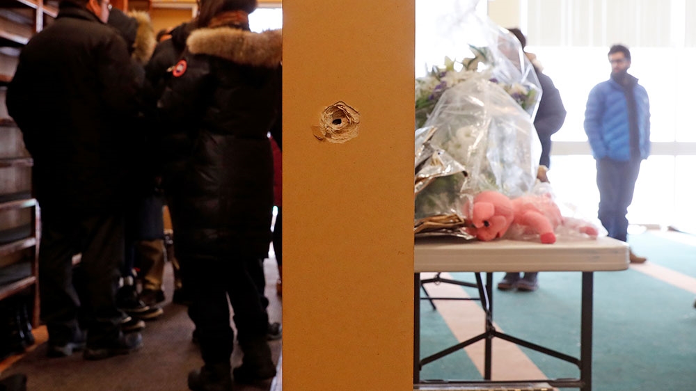 
A bullet hole is pictured at the Quebec mosque after the shooting [Mathieu Belanger/Reuters]
