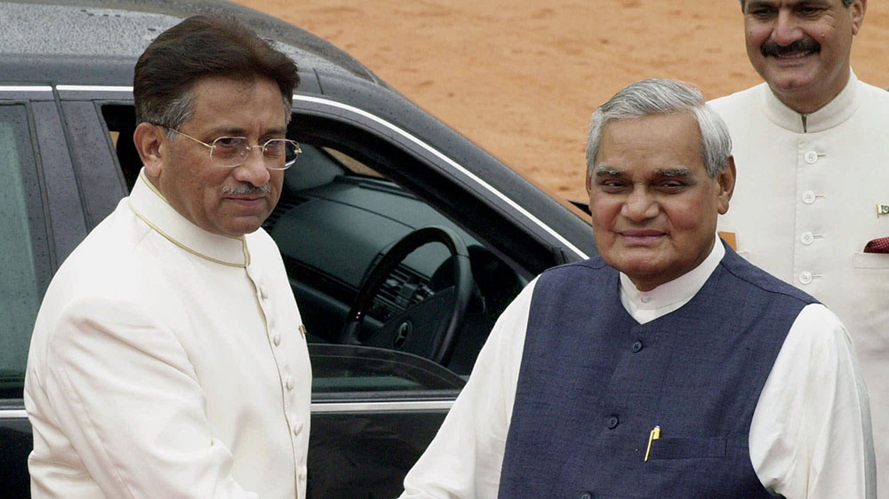 Pakistani President General Pervez Musharraf, left, is greeted by Indian Prime Minister Atal Bihari Vajpayee at the Presidential Palace in New Delhi on July 14, 2001. [Ajit Kumar/The Associated Press]
