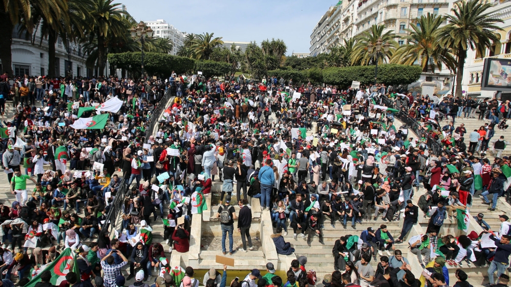 Students take part in a protest to denounce an offer by President Abdelaziz Bouteflika to run in elections next month but not to serve a full term if re-elected, in Algiers