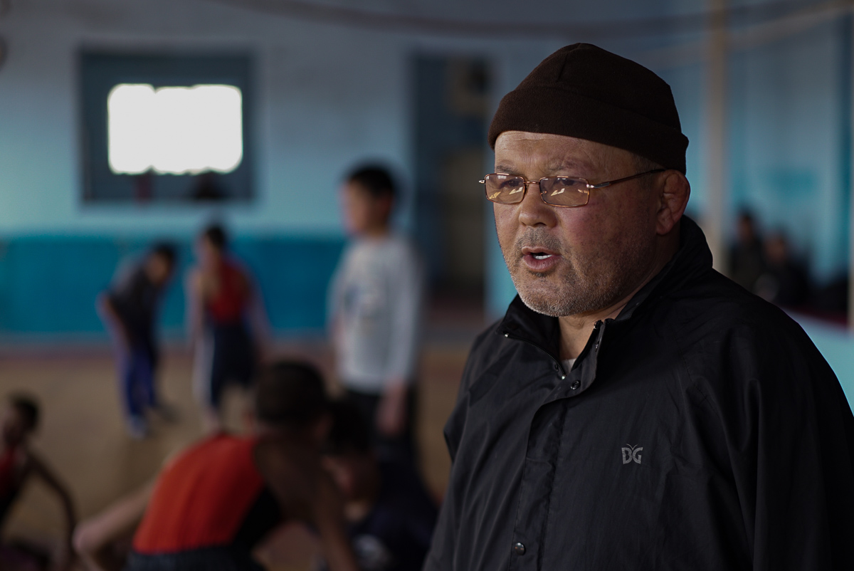 Coach Abbas has taught wrestling for more than 30 years, he says, ''Even if I lose both my arms and legs, I will coach through my words.'' [Sorin Furcoi/Al Jazeera]