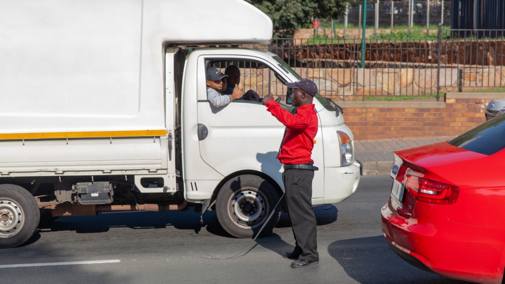 Regular commuters have formed a friendly relationship with the men on patrol [Tshego Mmahlatji/Al Jazeera]