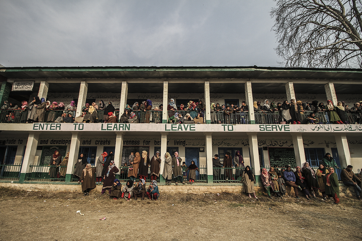 Women watching funeral prayer of a rebel in Arwani village in South Kashmir. [Sameer Mushtaq/Al Jazeera]