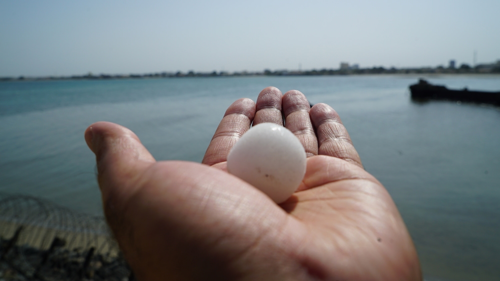 
The spheres of salt can vary in size from caviar eggs to small peaches [Faisal Edroos/Al Jazeera]
