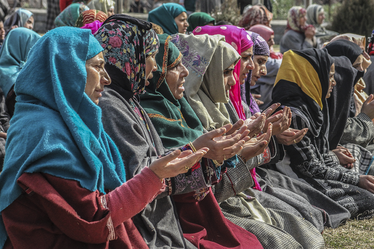 Women pray outside shrine in Anantnag town of South Kashmir. Due to continuing turmoil, women in Kashmir have been going through immense hardships. For instance the mother who loses her son is being s