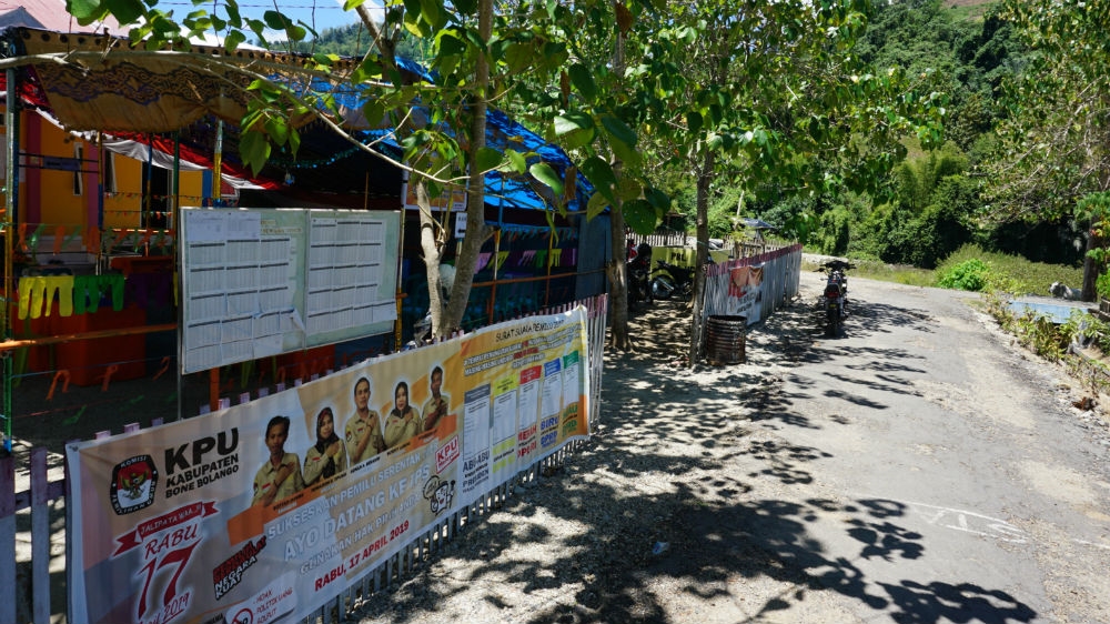 Up in the mountains of Sulawesi, ballot papers, boxes and other equipment sometimes have to be delivered by dirt bike or on foot. [Ian Morse/Al Jazeera]