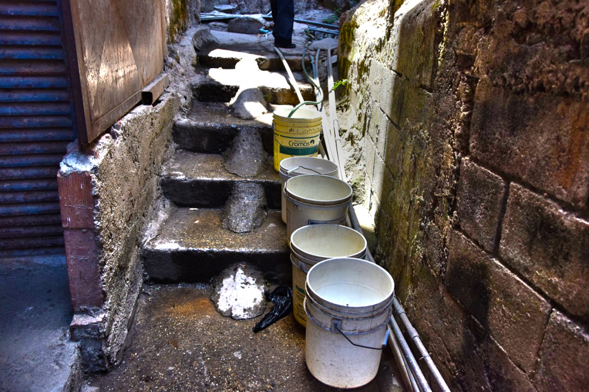 Faced with uncertainty of when water supply may return, people are conserving as much water as they can take when they find it available [Elizabeth Melimopoulos/ Al Jazeera]