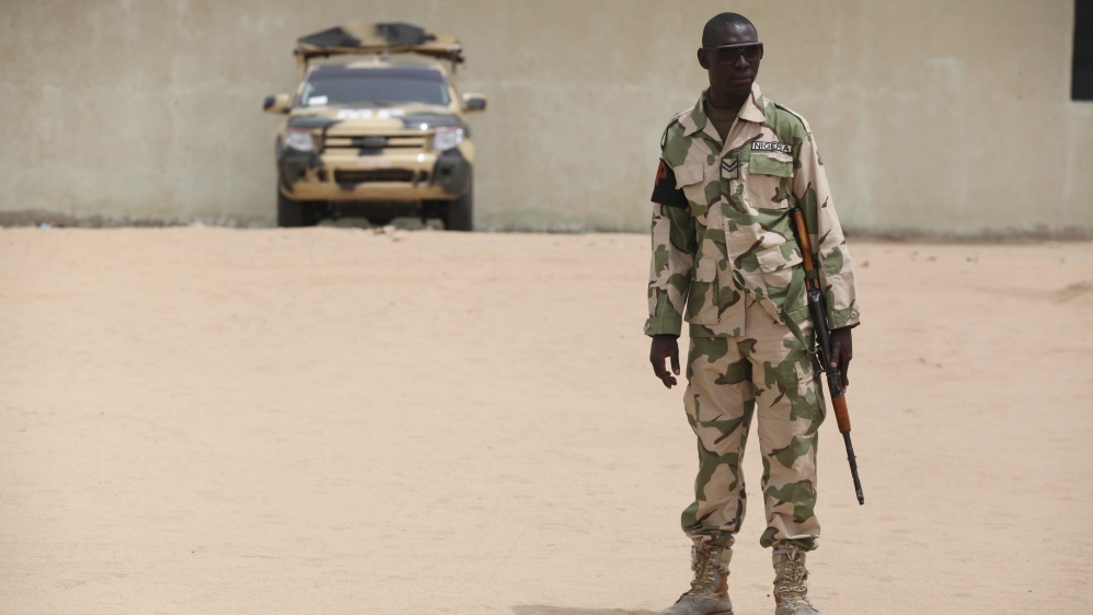 A soldier stands guard at a military base in Maiduguri, Nigeria