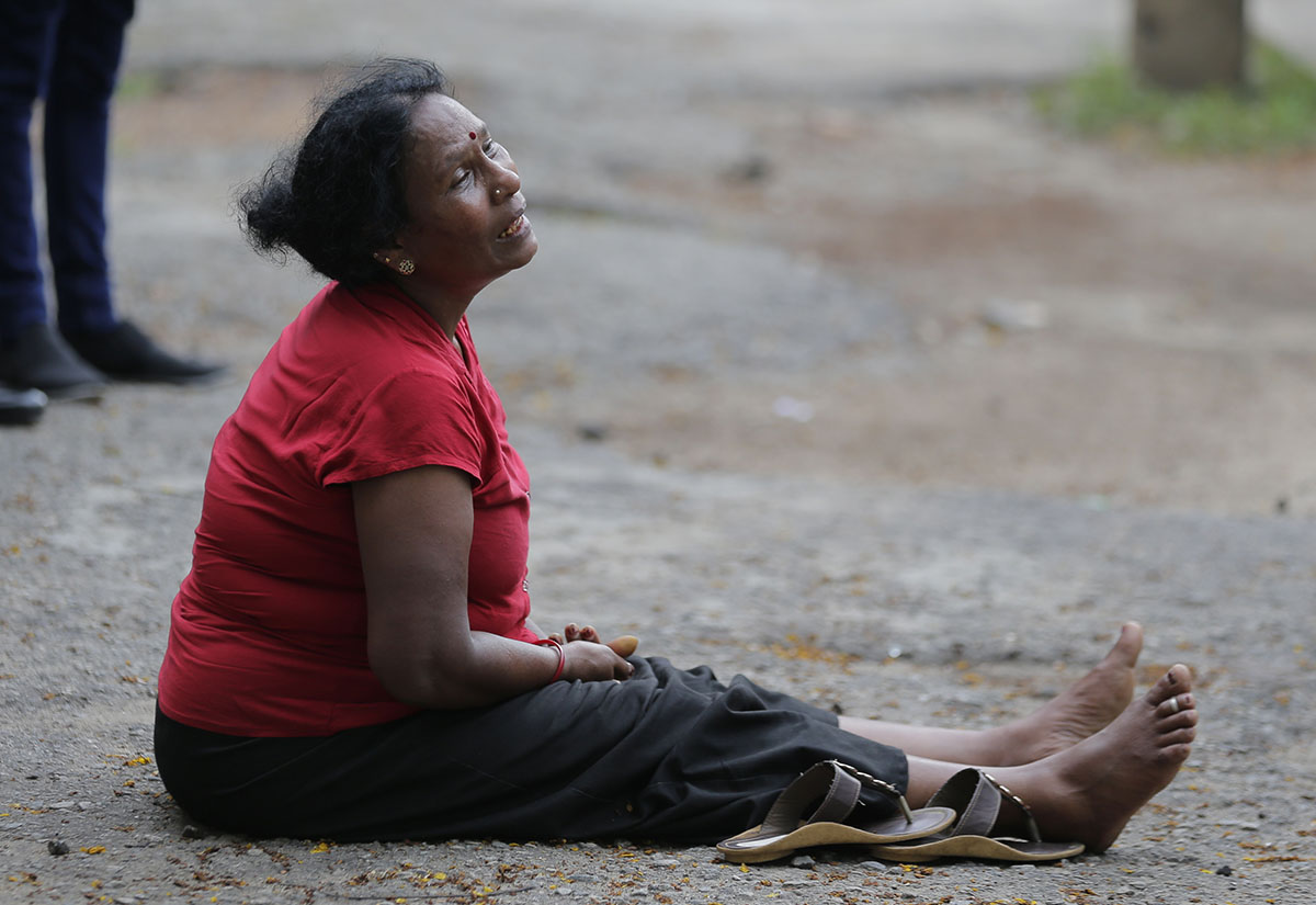 A relative of a blast victim grieves outside a morgue in Colombo, Sri Lanka, Sunday, April 21, 2019. More than hundred were killed and hundreds more hospitalized with injuries from eight blasts that r