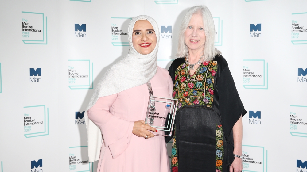 Author Jokha Alharthi (L) and translator Marilyn Booth pose after winning the Man Booker International Prize