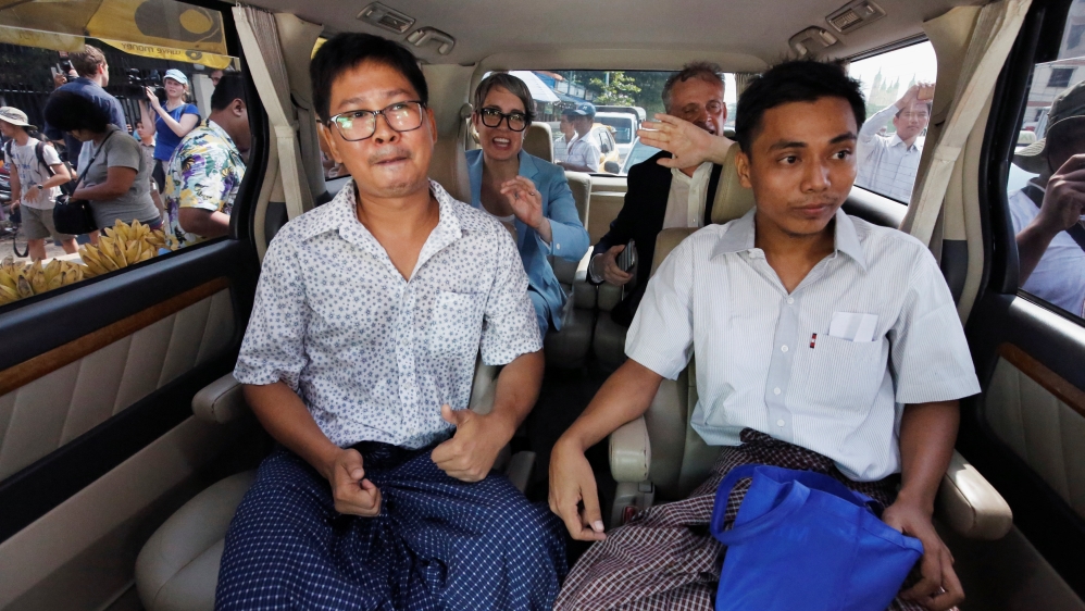 Reuters reporters Wa Lone and Kyaw Soe Oo react in a vehicle after being freed from Insein prison after receiving a presidential pardon in Yangon, Myanmar, May 7, 2019. REUTERS/Ann Wang