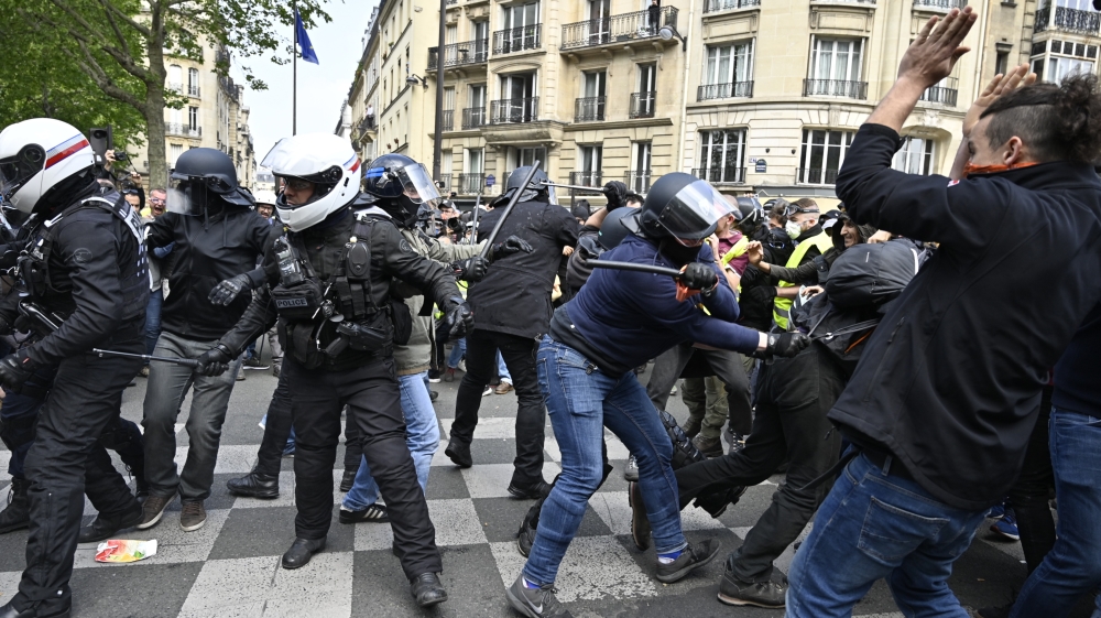 Riot police used tear gas and water cannon, and charged sporadically at several points along the traditional rally to disperse groups of masked protesters [Mustafa Yalcin/Anadolu]