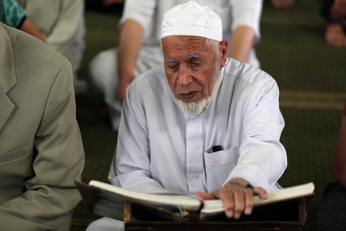 A Palestinian man reads Koran in a mosque, on the first day of the Muslim holy month of Ramadan, in the southern Gaza Strip May 6, 2019. REUTERS/Ibraheem Abu Mustafa