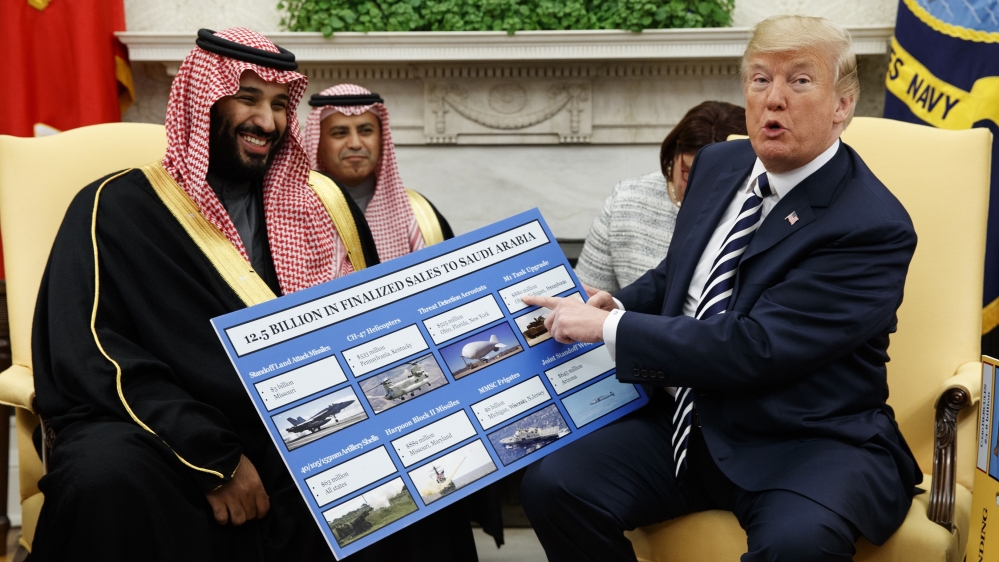 In this March 20, 2018 file photo, President Donald Trump shows a chart highlighting arms sales to Saudi Arabia during a meeting with Saudi Crown Prince Mohammed bin Salman