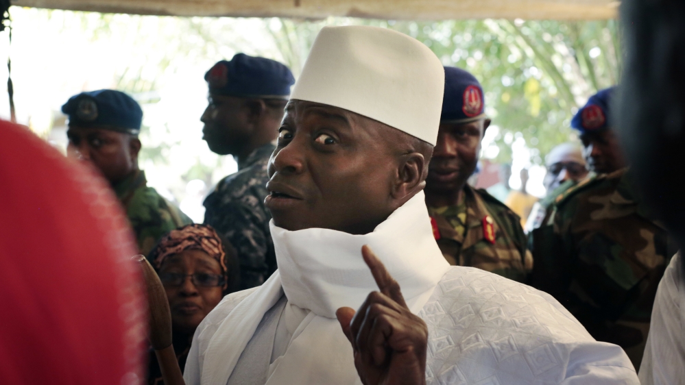 In this December 1, 2016 photo, Gambia's President Yahya Jammeh shows his inked finger before voting in Banjul, Gambia