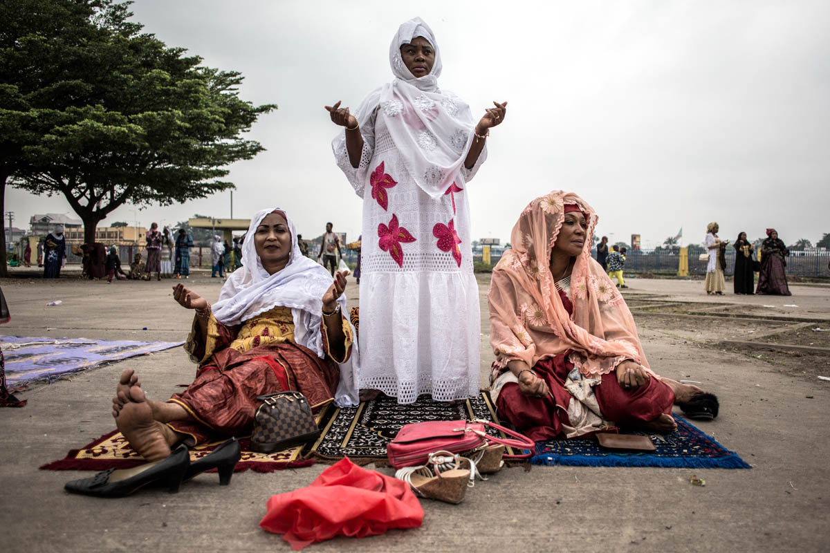 Muslim worshippers pray during a mass prayer to celebrate Eid al-Fitr on June 4, 2019 at the Stade des Martyrs in Kinshasa. Muslims worldwide celebrate the Eid al-Fitr holidays, which mark the end of